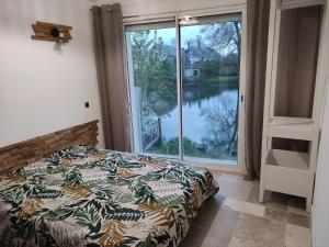 Posteľ alebo postele v izbe v ubytovaní Détente au bord du Loir - Spa Sauna - Gîte 3