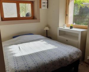 Posteľ alebo postele v izbe v ubytovaní Le Chalet du BioT