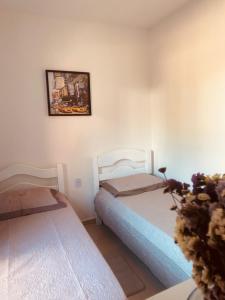 En eller flere senge i et værelse på Casa Villa Serrano