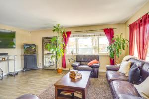 a living room with two couches and a fireplace at Newport Beach Vacation Rental Steps to Shore! in Newport Beach