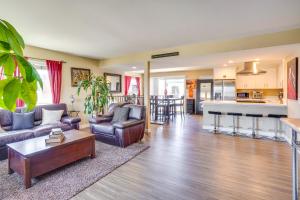 a living room with couches and a kitchen at Newport Beach Vacation Rental Steps to Shore! in Newport Beach