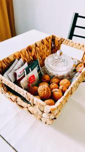 a basket filled with different types of bread on a table at Departamentos PLENO CENTRO in Tupungato