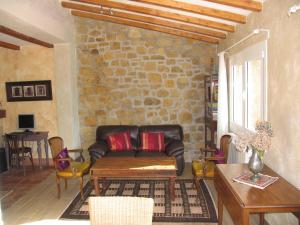 a living room with a leather couch and a table at Igeldo in Orio