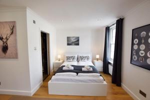 Säng eller sängar i ett rum på Central London Luxury Apartments