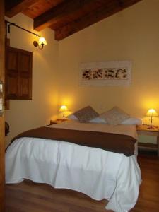 Ένα ή περισσότερα κρεβάτια σε δωμάτιο στο El Rincon de la Trilla - El Pajar