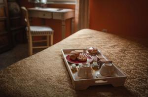 a tray of donuts sitting on a bed at B&B Candalla in Camaiore
