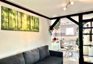 a living room with a couch and a table at Seppala charmant appartement in Colmar