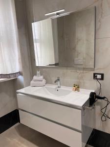 a bathroom with a white sink and a mirror at B&B ReLu' in Gallipoli +32 photos