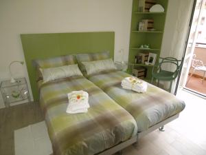 Postel nebo postele na pokoji v ubytování B&B Linea Verde