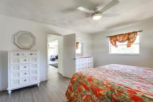 a bedroom with a bed and a ceiling fan at Sarasota House with Private Pool - 4 Mi to Beach! in Sarasota +24 photos