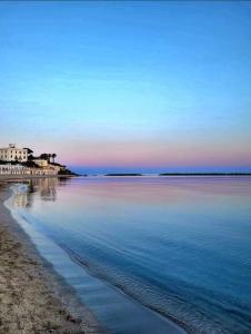 a view of a beach with the sky and the water at Central Station House in Santa Marinella