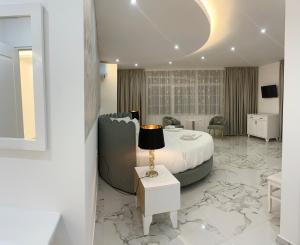 Postel nebo postele na pokoji v ubytování UJVARA HOTEL