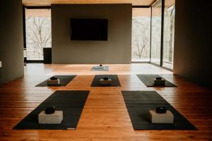 a room with four yoga mats on the floor at AutoCamp Yosemite in Midpines