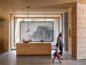 a woman and a child walking through a room at AutoCamp Yosemite in Midpines +37 photos