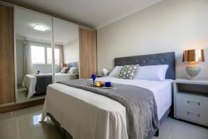 En eller flere senge i et værelse på PRG23 - Garagem, 4 Dorm, Próx Shopping Atlântico