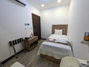 Postel nebo postele na pokoji v ubytování Hotel Cayuga