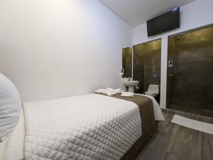 Postel nebo postele na pokoji v ubytování Hotel Cayuga