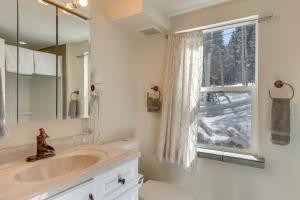 a bathroom with a sink and a window at Idaho Springs Cabin with Hot Tub on Half Acre! in Idaho Springs +28 photos