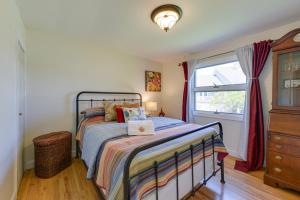 a bedroom with a bed and a window at New Jersey Cottage with Grill - Short Walk to Beach! in Del Haven