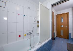 a bathroom with a shower with a glass door at Gea Maleme in Maleme