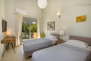 A bed or beds in a room at Gea Maleme