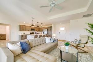 a living room with a couch and a table at Home with Lanai and Community Perks in The Villages! in Leesburg