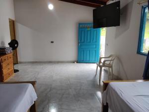 Postel nebo postele na pokoji v ubytování Hosteria Puerta del Nus