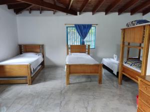 Postel nebo postele na pokoji v ubytování Hosteria Puerta del Nus