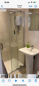 a bathroom with a shower and a sink at West Highland Way Rooms ED30002F in Milngavie