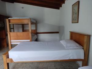 Postel nebo postele na pokoji v ubytování Hosteria Puerta del Nus