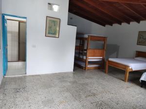 Postel nebo postele na pokoji v ubytování Hosteria Puerta del Nus