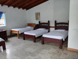 Postel nebo postele na pokoji v ubytování Hosteria Puerta del Nus