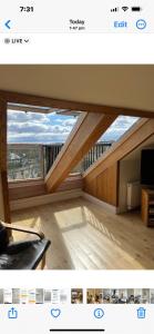 uma imagem de uma sala de estar com uma grande janela em West Highland Way Rooms ED30002F em Milngavie