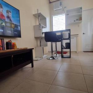 a living room with a flat screen tv on the wall at CityLofts Plainview in Mandaluyong corner unit in Manila