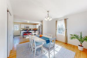 a kitchen and dining room with a table and chairs at Blue Jay in Castine