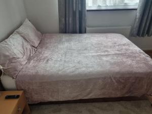 A bed or beds in a room at Private Double Room in London
