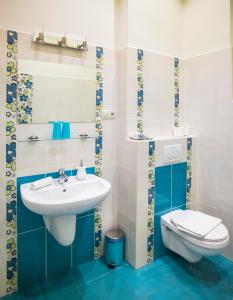 a bathroom with a sink and a toilet at Budapest Rooms Bed and Breakfast in Budapest