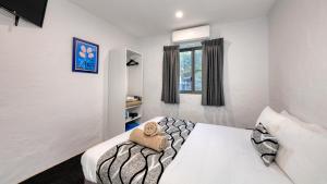 Parkes Federation Motel客房内的一张或多张床位