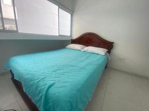 A bed or beds in a room at HABITACION CON BAÑO PRIVADO PARA 1 O 2 PERSONAS