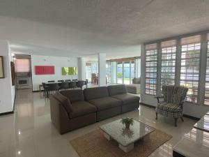 a living room with a couch and a table at CasaMar House Whit Pool 3 Bedrooms 3 Bathrooms in San Juan
