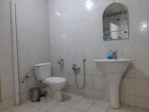 a bathroom with a toilet and a sink at BAKU GUEST HOSTEL in Baku