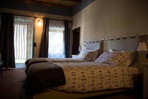 Postel nebo postele na pokoji v ubytování Tenuta Valtoppa