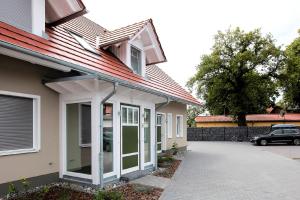 a house with a car parked in front of it at FeWo Bark Middenmang in Wustrow