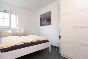 Ένα ή περισσότερα κρεβάτια σε δωμάτιο στο Haus Sanddorn Hooghass FW3