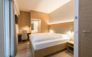 Posteľ alebo postele v izbe v ubytovaní Hotel Post Gries