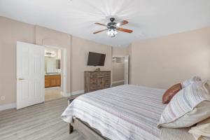 a bedroom with a bed and a ceiling fan at Beautiful Spacious Single Story Vegas Home in Las Vegas