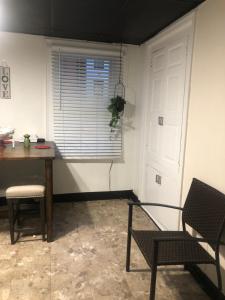 a room with a table and chairs and a window at roceruzdevelopments llc in Baltimore