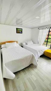 Кровать или кровати в номере Casa de campo en Barbosa - a 3 minutos del centro