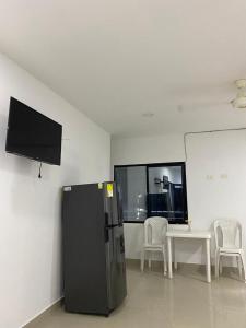 TV a/nebo společenská místnost v ubytování APARTAMENTO EN DORADAL A 12 minutos de Nápoles