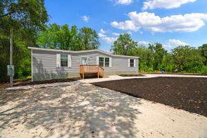 a house with a driveway in front of it at 3 King Bedrooms - Beautiful New Port Richey in New Port Richey